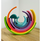 Colourful wooden ring set on a wooden surface